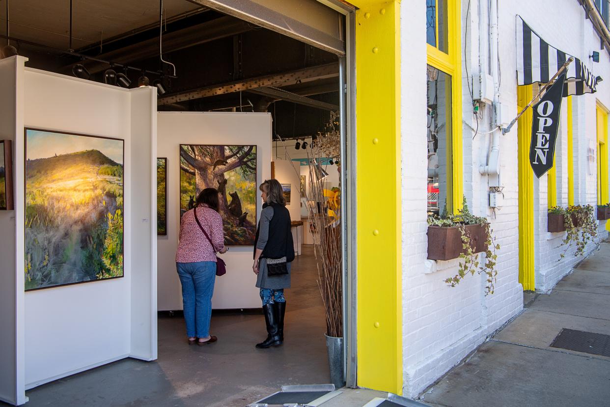 People visit the Mark Bettis Gallery in the River Arts District in Asheville, March 4, 2024.