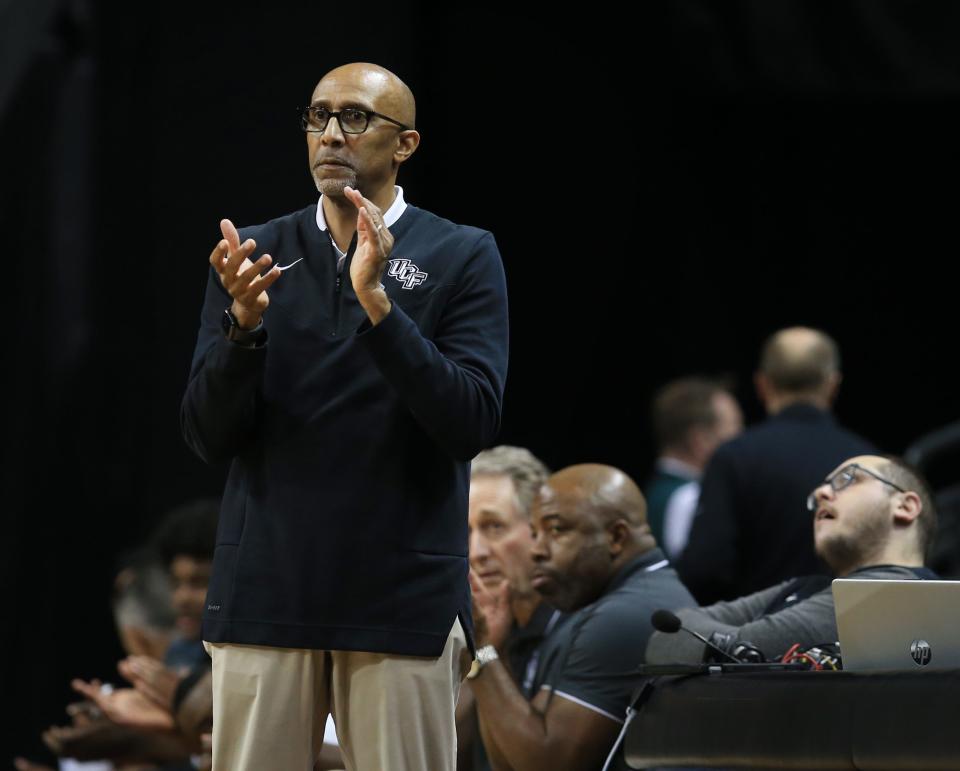 Central Florida head coach Johnny Dawkins
watches his team during the first half against Oregon in the second round of the NIT Sunday, March 19, 2023, in Eugene.