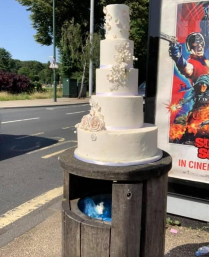 viral photo of wedding cake on london rubbish bin