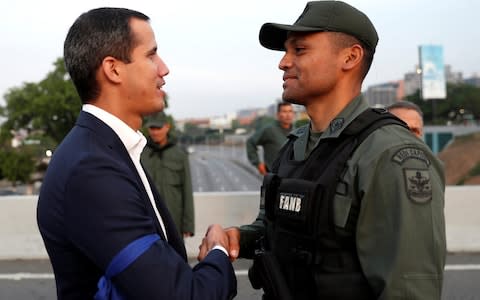 Venezuelan opposition leader Juan Guaido posted a video if himself near the Generalisimo Francisco de Miranda Airbase in Caracas - Credit: REUTERS/Carlos Garcia Rawlins