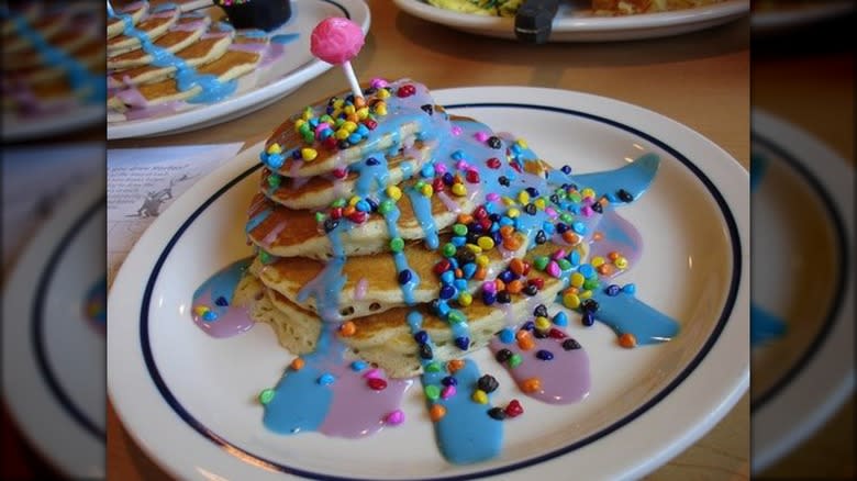 Five pancakes blue sauce and candy