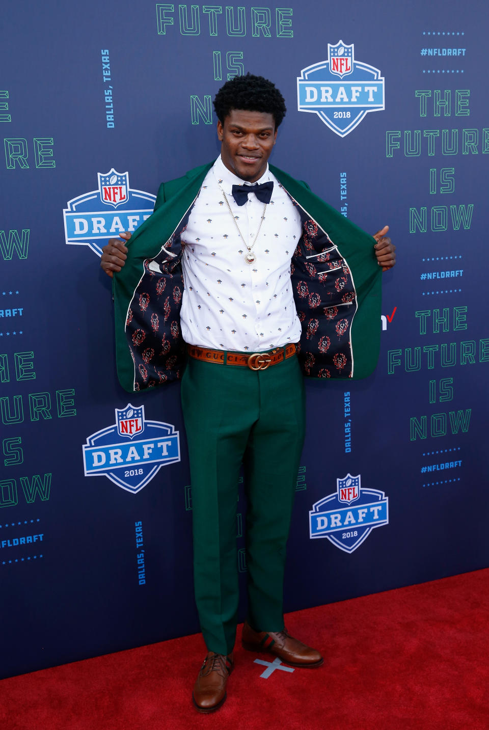 <p>Lamar Jackson of Louisville poses on the red carpet prior to the start of the 2018 NFL Draft at AT&T Stadium on April 26, 2018 in Arlington, Texas. (Photo by Tim Warner/Getty Images) </p>