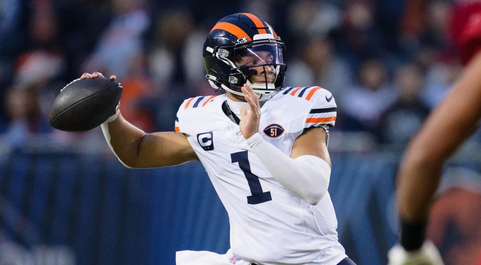 Dec 24, 2023; Chicago, Illinois, USA; Chicago Bears quarterback Justin Fields (1) in action against the Arizona Cardinals at Soldier Field. Mandatory Credit: Jamie Sabau-USA TODAY Sports