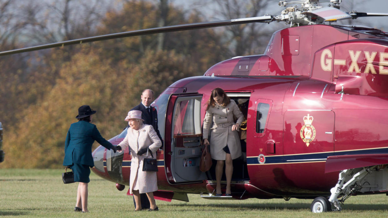 Queen Elizabeth II arriving by helicopter