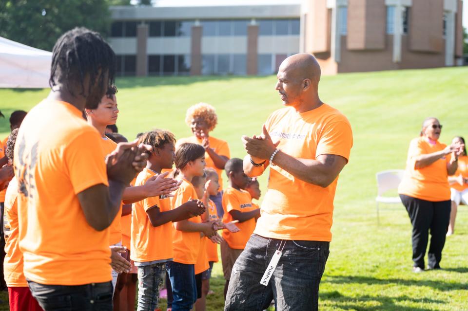 R.I.S.E. founder Damon Brown leads Freedom School students in a song during their Day of Social Action at Kellogg Community College on Wednesday, July 19, 2023.