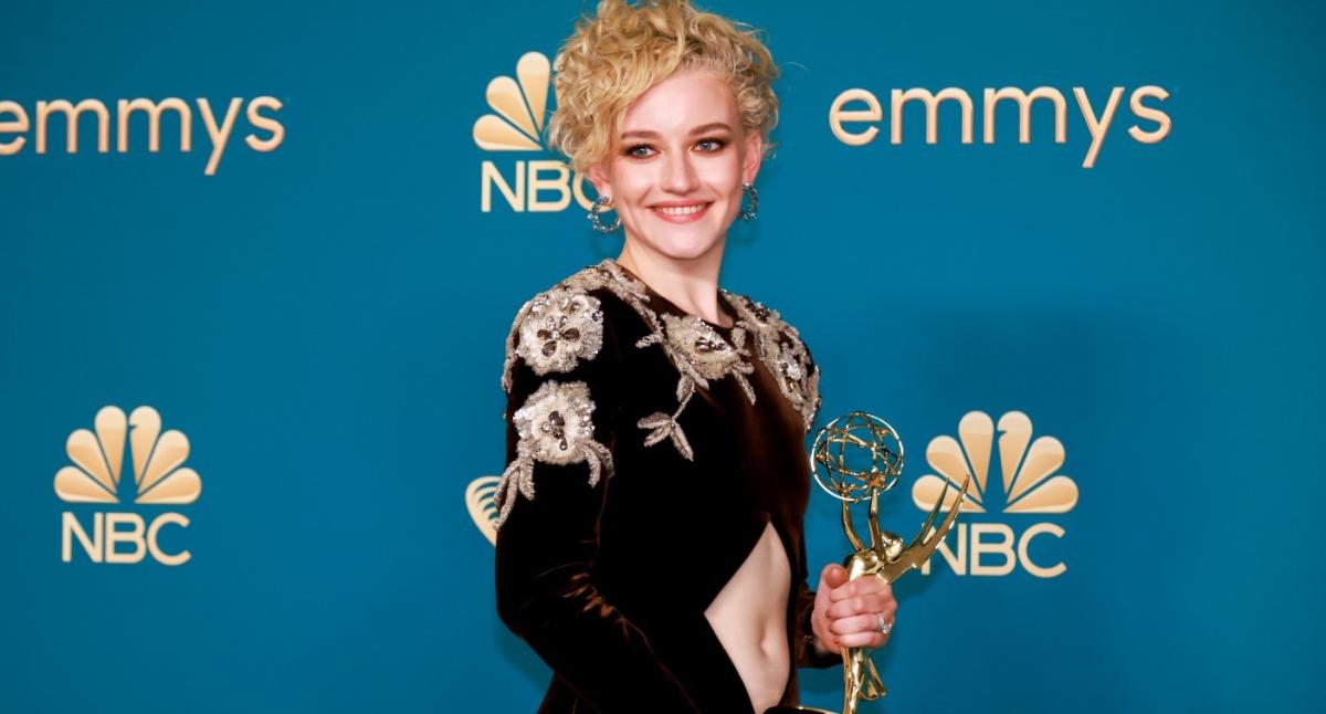 Julia Garner stuns in a glitzy plunging dress as she arrives at