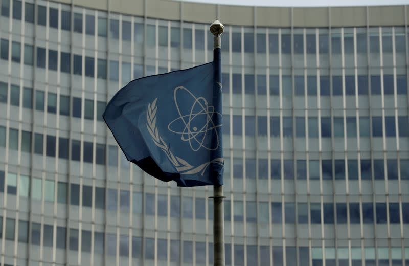 The flag of the International Atomic Energy Agency (IAEA) flutters in front of its headquarters in Vienna