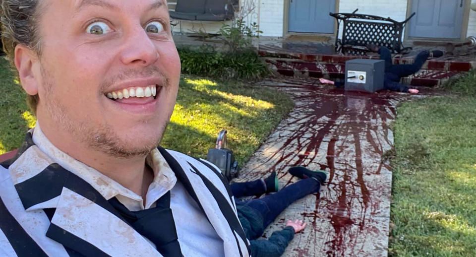 Steven Novak in front of his home in Dallas with Halloween decorations. Fake blood is seen splattered on the footpath.