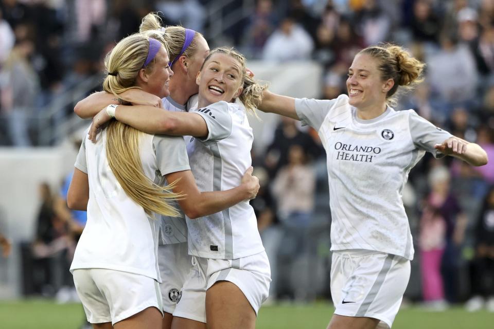 Mikayla Cluff #16, Megan Montefusco #5, Courtney Petersen #17 and Celia Jiménez Delgado #13 of the Orlando Pride celebrate after their 1-0 win against Angel City FC at Banc of California Stadium on May 08, 2022 in Los Angeles, California.