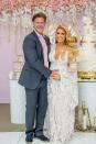 If it felt like a wedding, that's because it nearly could have been. As Rossi teased the crowd, there was an ordained pastor at the event, and she and Smiley thought about turning it into a wedding. "We're <a rel="nofollow noopener" href="https://people.com/tv/real-housewives-of-orange-county-gretchen-rossi-slade-smiley/" target="_blank" data-ylk="slk:not getting married, I hate to;elm:context_link;itc:0;sec:content-canvas" class="link ">not getting married, I hate to</a> burst your bubble," she said. "Yes, my dress is white. And we thought about it for a very small second and then I thought, 'Wouldn't it be fun to have another big party?' "