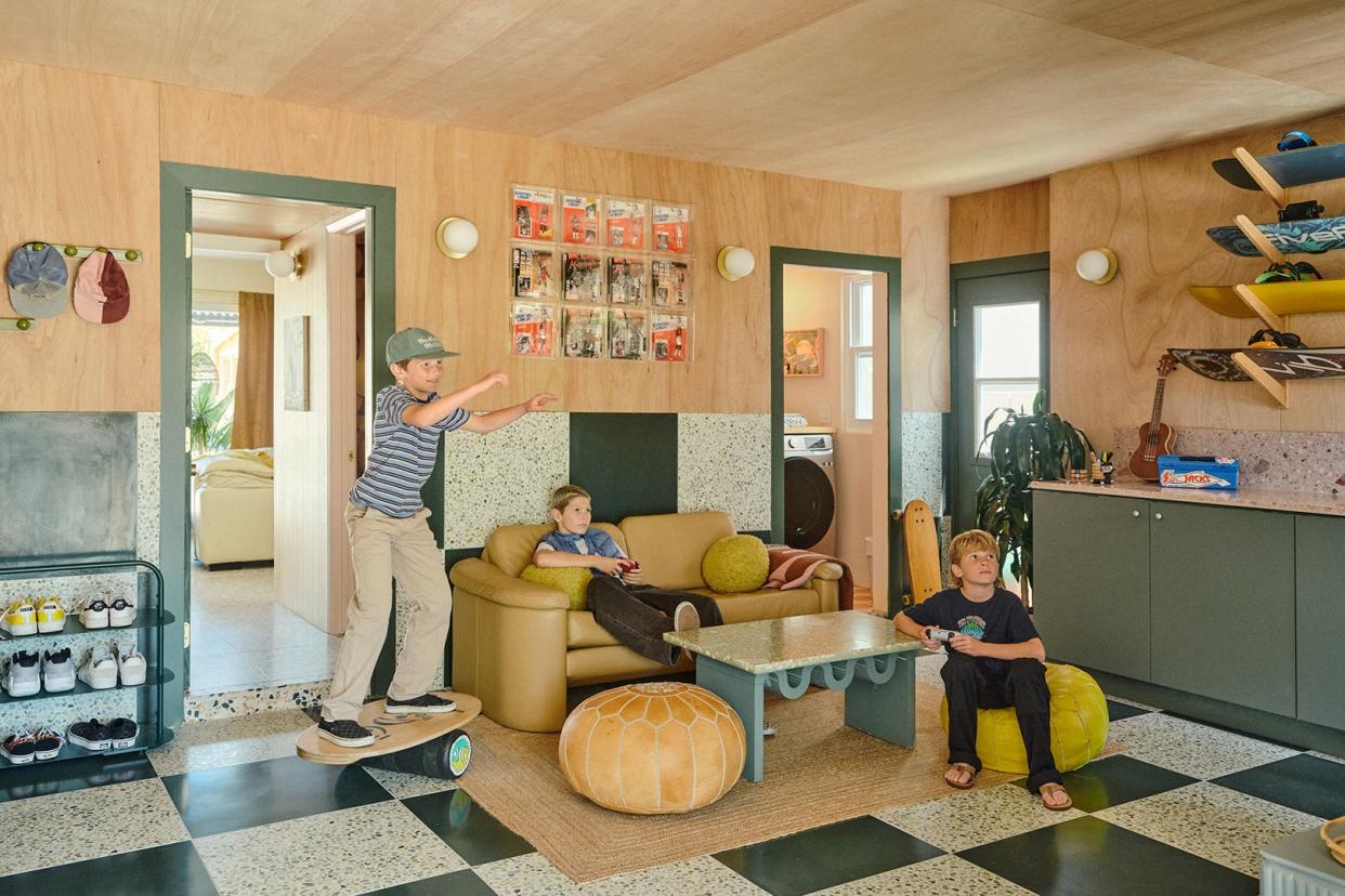 Kids playing video games in a family room