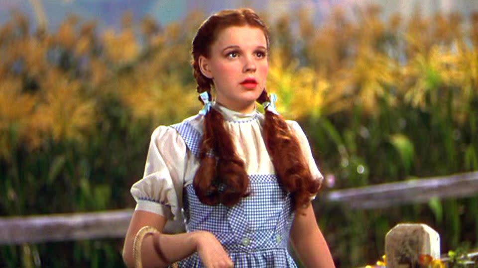 Judy Garland, pictured in "The Wizard of Oz," was embraced by her LGBTQ fans in life and in death. - Mgm/Kobal/Shutterstock