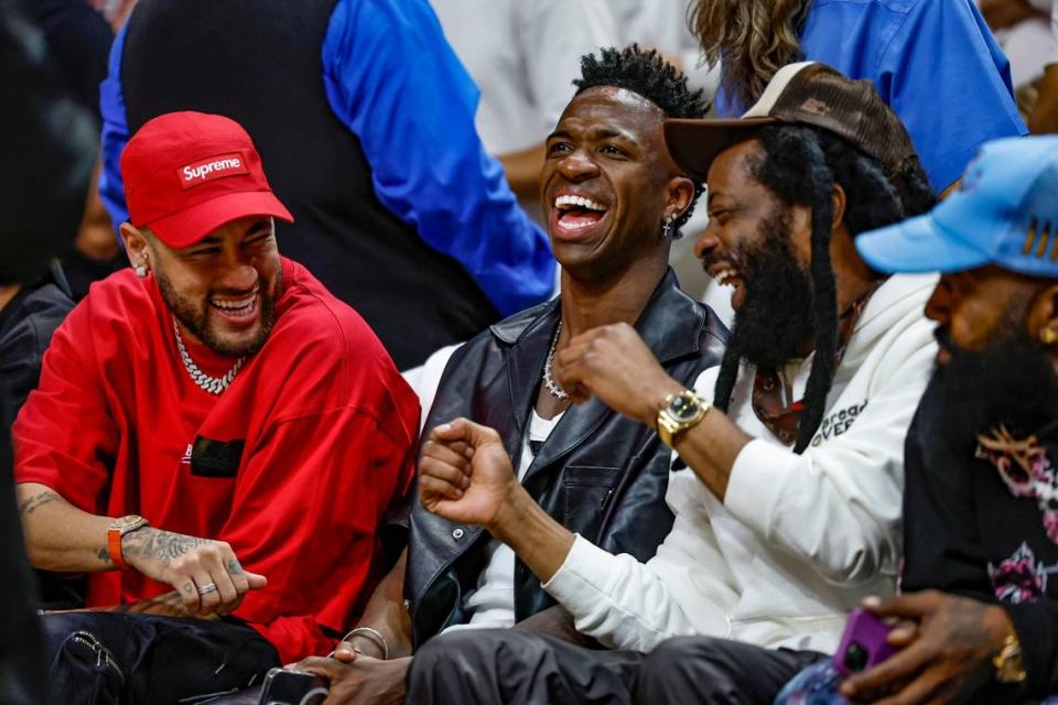 Brazilian coccer players Neymar Jr. and Vinicius Jr. react from courtside seats during the first half of Game 4 of the NBA Finals at the Kaseya Center in downtown Miami, Fla. on Friday, June 9, 2023.