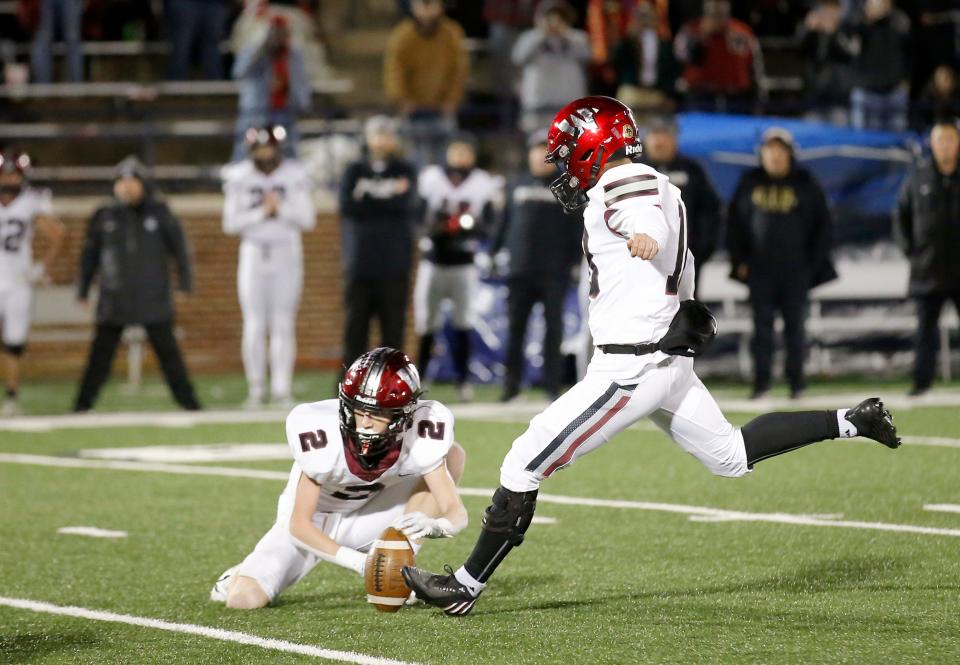 Wagoner's Ethan Muehlenweg (18) kicks the game winning field goal as Brayden Skeen holds during the Class 4A football state championship between Cushing and. Wagoner at Chad Richison Stadium in Edmond, Okla., Saturday, Dec., 3, 2022. 