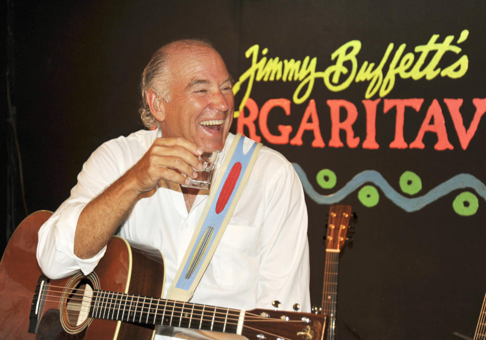 FILE - Jimmy Buffett takes a break during a set of music at his Margaritaville Cafe in Key West, Fla in Feb. 12, 2009. Buffett, who popularized beach bum soft rock with the escapist Caribbean-flavored song “Margaritaville” and turned that celebration of loafing into an empire of restaurants, resorts and frozen concoctions, has died, Friday, Sept. 1, 2023. (Rob O'Neal /The Key West Citizen via AP)