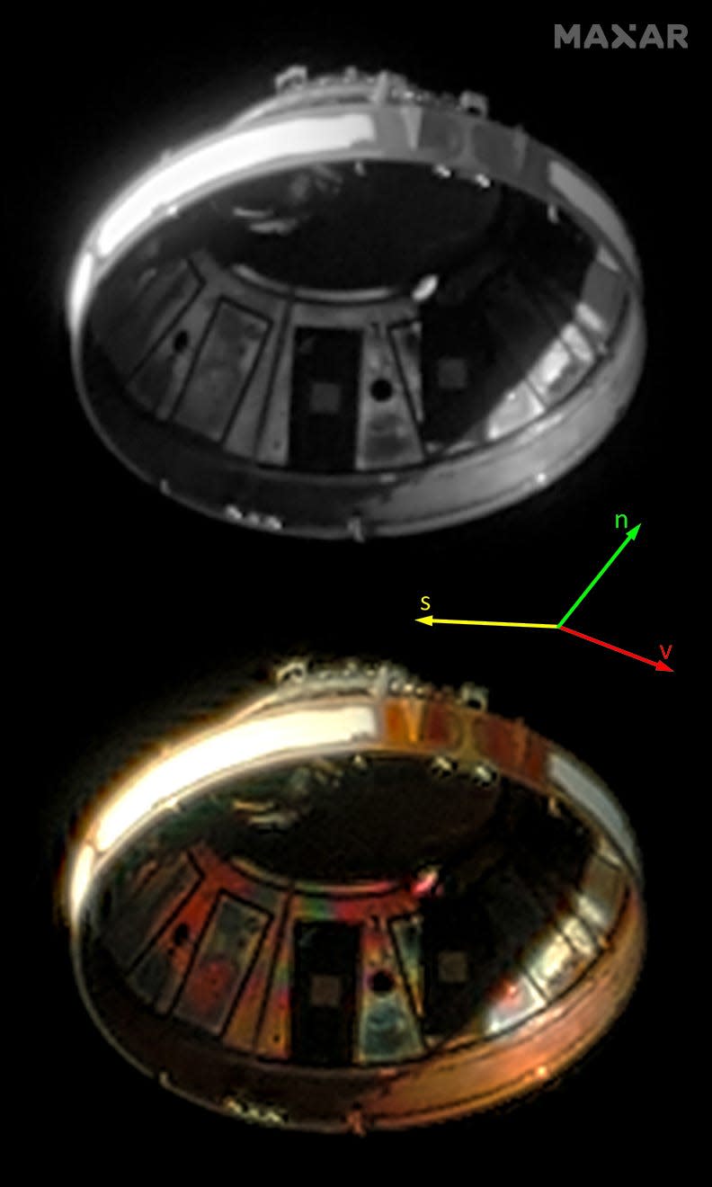 a dome shaped piece of spacecraft with panels in space in two mirror images one black and white the other gold colored