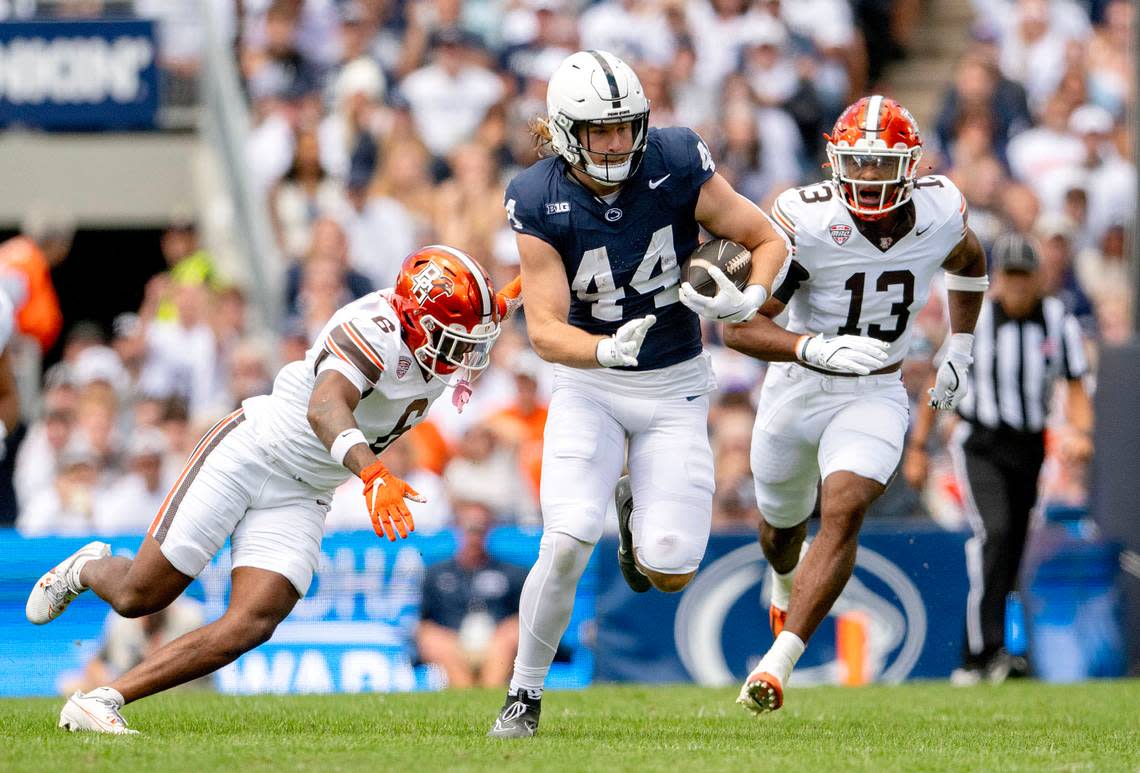 Penn State tight end Tyler Warren cuts down the field with the ball ahead of Bowling Green defenders during the game on Saturday, Sept. 7, 2024.