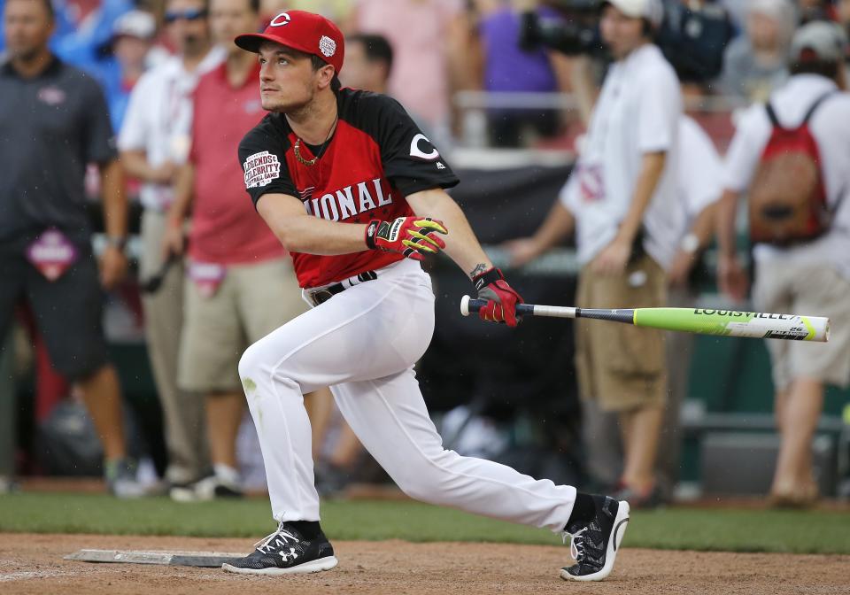 Josh Hutcherson watches the ball fly off his bat during the Legends and Celebrity Softball game, Sunday, July 12, 2015, at Great American Ball Park.