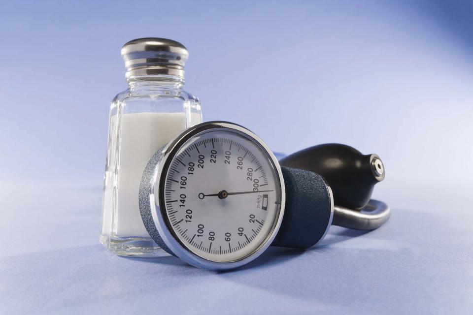 Extra salt may contribute to high blood pressure. <a href="https://www.gettyimages.com/detail/photo/blood-pressure-cuff-and-salt-royalty-free-image/86495796" rel="nofollow noopener" target="_blank" data-ylk="slk:Jupiterimages/Stockbyte via Getty Images;elm:context_link;itc:0;sec:content-canvas" class="link ">Jupiterimages/Stockbyte via Getty Images</a>