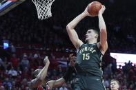 Purdue center Zach Edey (15) goes to the basket past Rutgers forward Aundre Hyatt in the first half of an NCAA college basketball game, Sunday, Jan. 28, 2024, in Piscataway, N.J. (AP Photo/Mary Altaffer)