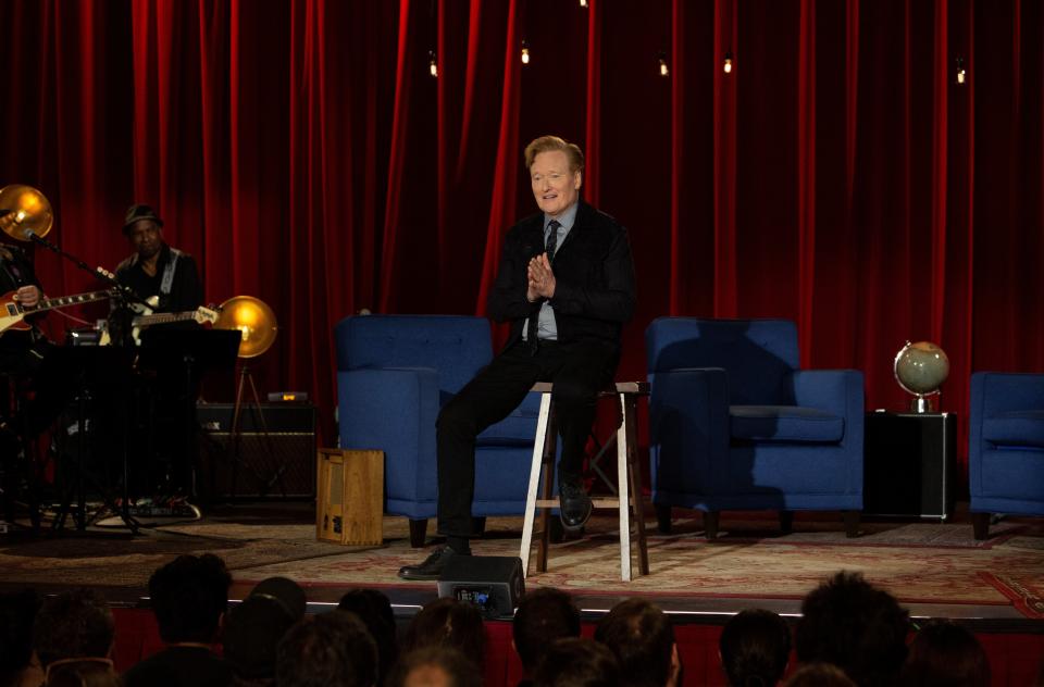 Conan O'Brien, sitting on a stool in much the same way Johnny Carson did on his "Tonight Show" finale, thanks "Conan" staff and fans during the last episode of the TBS talk show.
