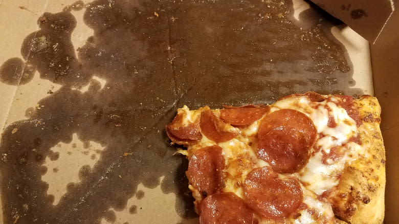 Pepperoni pizza surrounded by grease