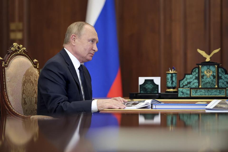 Russian President Vladimir Putin attends a meeting the Kremlin in Moscow, Russia, Monday, Nov. 29, 2021. (Evgeny Paulin, Sputnik, Kremlin Pool Photo via AP)