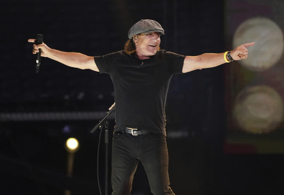 FILE - Brian Johnson of AC/DC performs with the Foo Fighters at "Vax Live: The Concert to Reunite the World" in Inglewood, Calif., on May 2, 2021. In his new memoir, the “Highway to Hell” singer recounts how he went from being a vinyl car roof fitter to leading one of the most hailed bands in the world. (Photo by Jordan Strauss/Invision/AP, File)