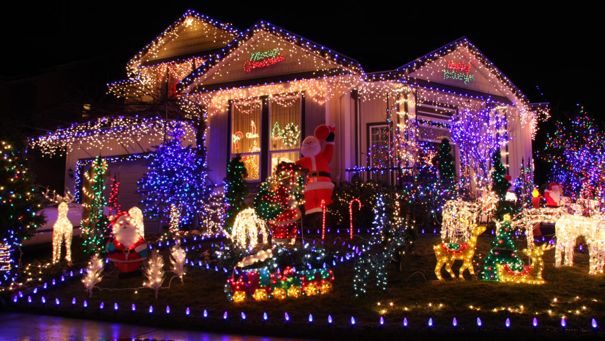  House covered with Christmas lighting. 