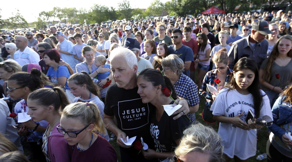 <p>Mourners gather during a prayer vigil following a shooting at Santa Fe High School in Santa Fe, Texas, on Friday, May 18, 2018. Seventeen-year-old Dimitrios Pagourtzis is charged with capital murder in the shooting rampage. A judge denied him bond at a court hearing Friday evening. (Photo: David J. Phillip/AP) </p>