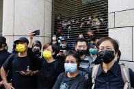 Supporters of pro-democracy activists queue up for a court hearing outside West Kowloon Magistrates' Courts, in Hong Kong