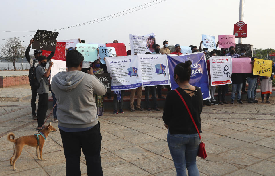 Activists participate in a silent protest against the arrest of environmental activist Disha Ravi in Hyderabad, India, Saturday, Feb. 20, 2021. The 22-year-old Indian climate activist who is facing sedition charges for her alleged role in the creation of an online document intended to help amplify farmer protests did not get bail Saturday after a court said it will reserve its order for next week. (AP Photo/Mahesh Kumar A.)