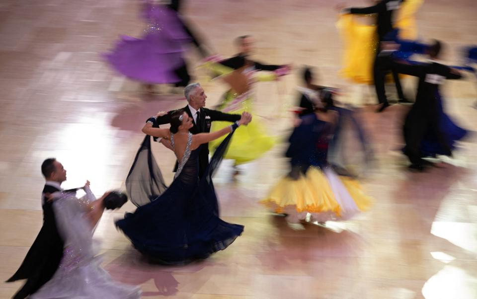 Dancers compete in a ballroom dancing competition at the Winter Gardens ballroom in Blackpool