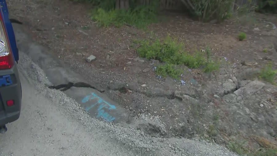 A large crack in the roadway due to an ongoing landslide in Ranchos Palos Verdes. (July 29, 2024)
