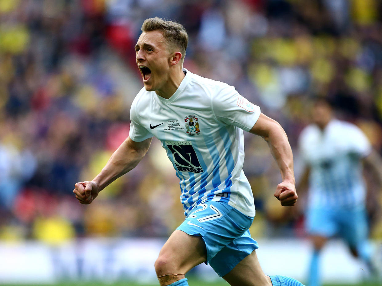 George Thomas celebrates after scoring Coventry's second goal in the EFL Checkatrade Trophy Final: Getty