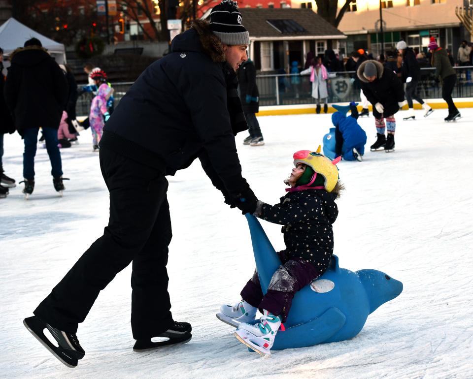 Mike Godlewski of Grafton pushes his daughter Colette, 4, around the Worcester Common Oval skating rink. School vacation hours will be 1 to 6 p.m. Saturday through Thursday. Hours are 1 to 9 p.m. Friday, and Saturday and Sunday, Feb. 24-25, hours will be 1 to 6 p.m.