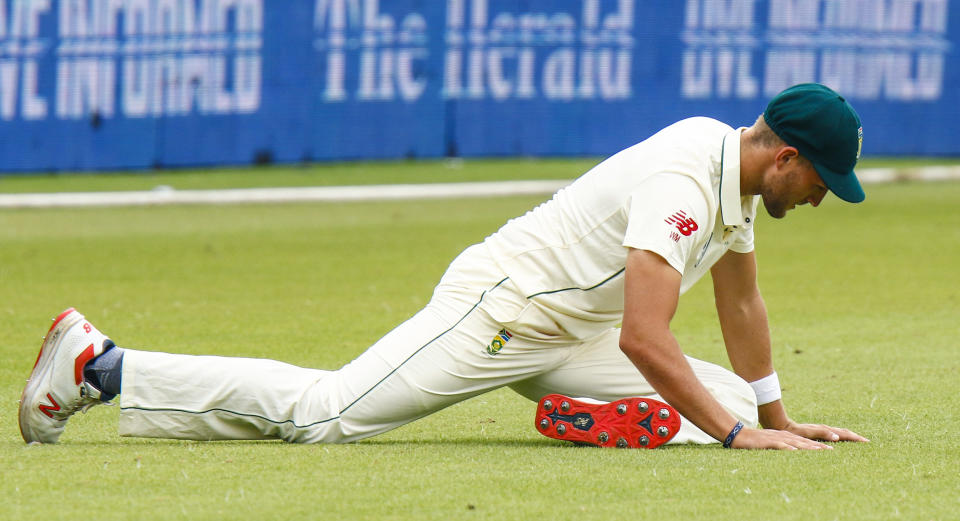 South Africa's Wiaan Mulder stretches on the field, during their third day of the second cricket test at St. George's Park in Port Elizabeth, South Africa between South Africa and Sri Lanka Saturday Feb. 23, 2019. (AP Photo/Michael Sheehan)