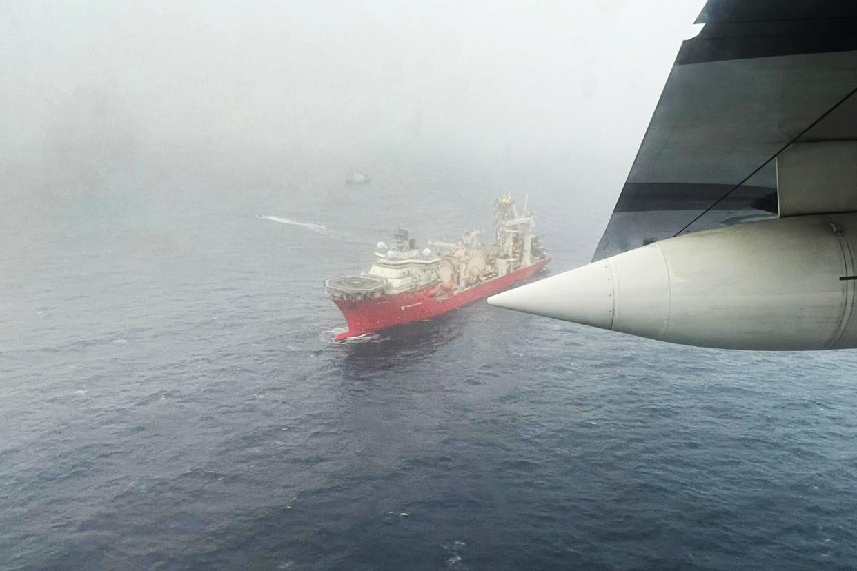 Images released by the U.S. Coast Guard show the Titan rescue efforts underway Tuesday. (@USCGNortheast / Twitter)