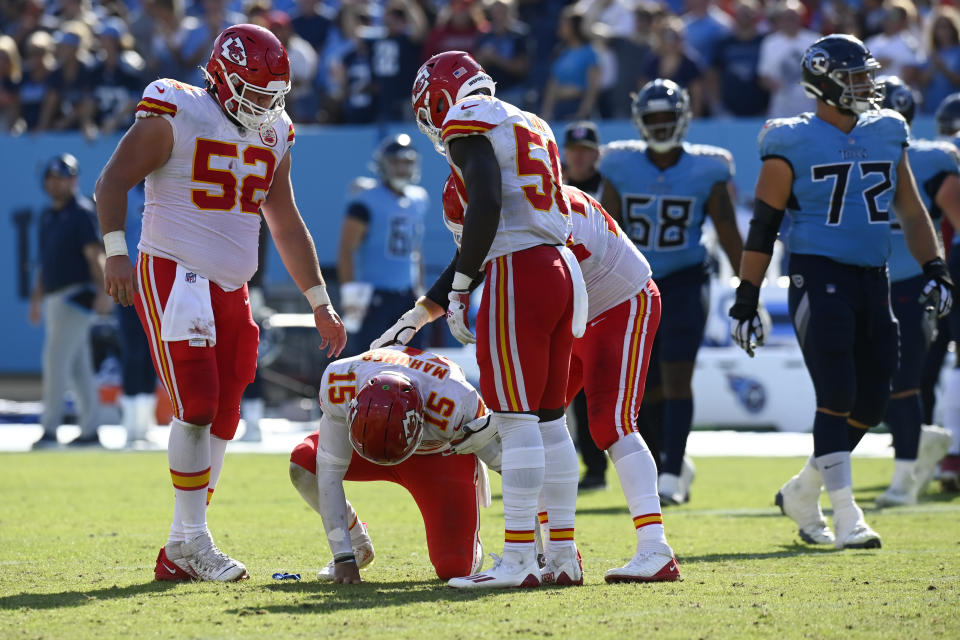 Kansas City Chiefs quarterback Patrick Mahomes (15) slowly gets up after being hit in the second half of an NFL football game against the Tennessee Titans Sunday, Oct. 24, 2021, in Nashville, Tenn. (AP Photo/Mark Zaleski)