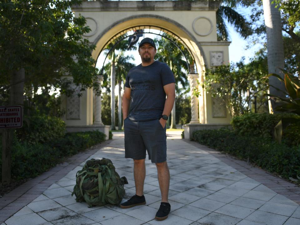 U.S. Marine Corps veteran Sgt. Billy Olswicki, 34, of Stuart, stands at the archway of Memorial Park on Wednesday, Nov. 1, 2023, in Stuart. On his first deployment in 2008, Olswicki served in a Marine scout sniper platoon in Fallujah, Iraq. During a second deployment to the Pacific, he was part of the re-taking in 2010 of the Magellan Star, a hijacked ship that had been taken over by Somali pirates.
