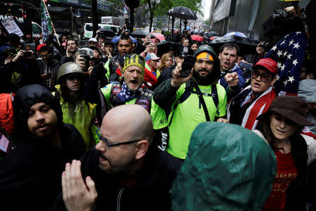 People protesting against CUNY’s decision to allow Linda Sarsour, a liberal, Palestinian-American political activist, to speak at this year’s commencement argue with anti-Trump demonstrators in New York, U.S., May 25, 2017. REUTERS/Lucas Jackson