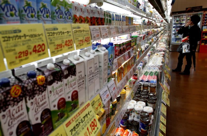 FILE PHOTO: FILE PHOTO: Shopper looks at items at a supermarket in Tokyo