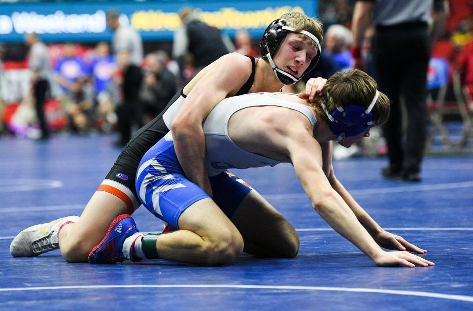 West Delaware's Brent Yonkovic wrestles Creston's Austin Evans at 138 pounds during the first round of Class 2A at the 2022 IHSAA State Wrestling Tournament at Wells Fargo Arena Feb. 17 in Des Moines.