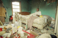 <p>Leroy Ferguson sits in the bedroom of his Homestead, Fla., home, the only room not destroyed in a fire caused by a kerosene lamp exploding, Sept. 11, 1992. Ferguson rode out Hurricane Andrew in this house built by his mother 67 years ago. (AP Photo/Doug Jennings) </p>