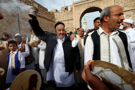 Libyan Sufi Muslims chant and beat drums during a procession to commemorate Prophet Mohammad's birthday, also known as Mawlid, in the old city of the Libyan capital Tripoli, Libya November 20, 2018. REUTERS/Ismail Zitouny