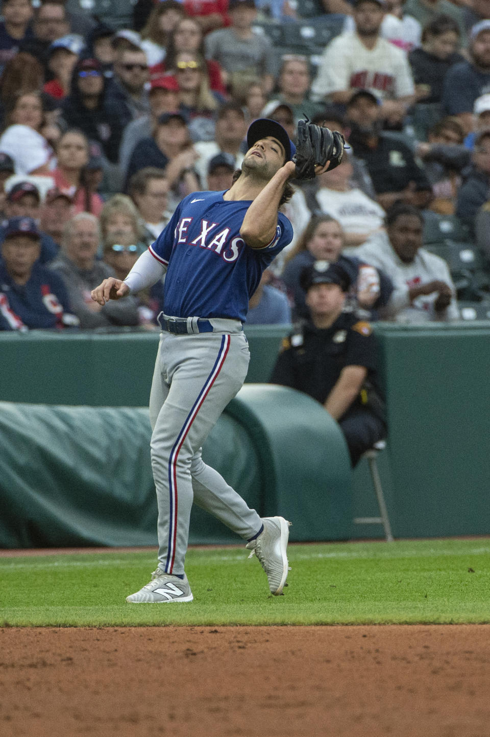 Texas Rangers' Josh Smith catches a pop fly by Cleveland Guardians' Bo Naylor during the third inning of a baseball game in Cleveland, Saturday, Sept. 16, 2023. (AP Photo/Phil Long)