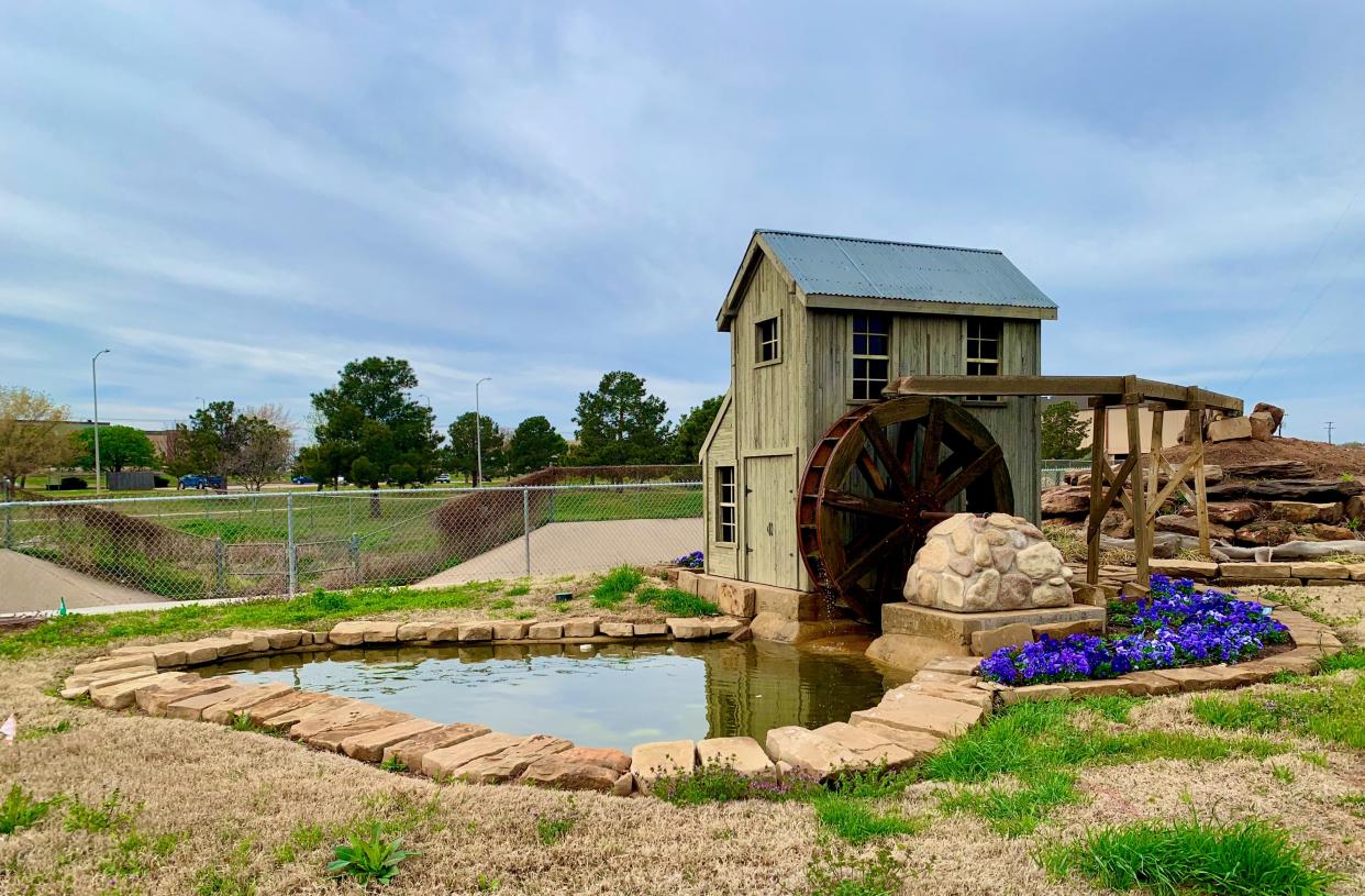 A water feature with a water wheel created by the city of Wichita Falls located off Lawrence Road.