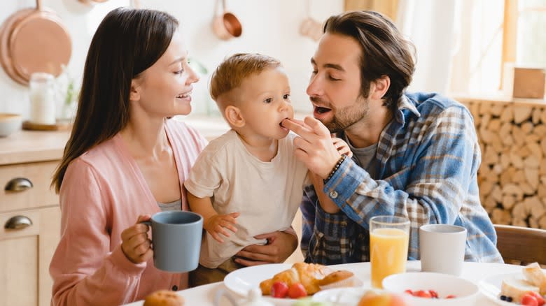 Parents and child eating