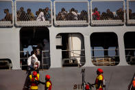 <p>An Italian military officer lifts a young child into a navy ship, evacuated by members of Proactiva Open Arms NGO, during a rescue operation at the Mediterranean sea, about 17 miles north of Sabratah, Libya, Saturday, Aug. 20, 2016. Migrants seemingly prefer to face the dangers of the journey towards Europe, rather than stay at home.(AP Photo/Emilio Morenatti) </p>