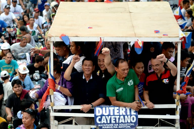 Philippine presidential candidate Rodrigo Duterte (C-L, in black) has gained support across all sectors of society by fashioning himself as an anti-establishment politician who can achieve quick fixes to deep-rooted problems